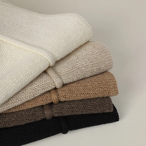 Breathable knit bucket hat in five earth tones featuring thick woven texture and bow detail
