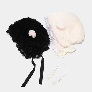 Plush lamb ear hats in black and beige with delicate lace trim and ribbon ties