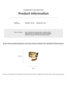Detailed view of golden multi-layer spiral arm cuff with high-shine polished finish