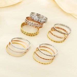Detailed view of roman numeral titanium bracelets in gold, silver and rose gold finishes