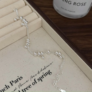 Minimalist 925 sterling silver beaded bracelet on a soft velvet jewelry organizer box