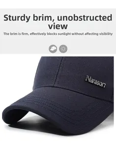 Detail of navy blue twill baseball cap showing Narason metal logo and premium stitching