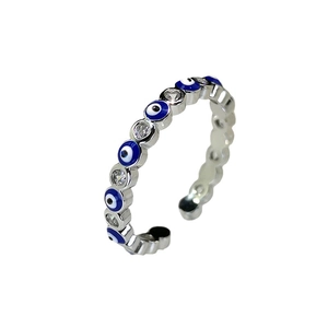 Silver Evil Eye open ring with blue enamel and white zircon stones in a wavy design