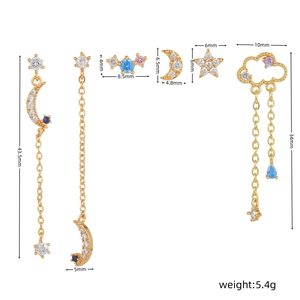 Detailed view of 925 silver stud earrings set with moon, star, and tassel charms