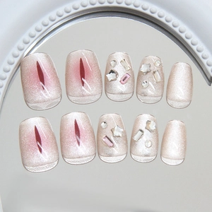 Champagne cat eye press-on nails with star rhinestones and sparkling diamond accents