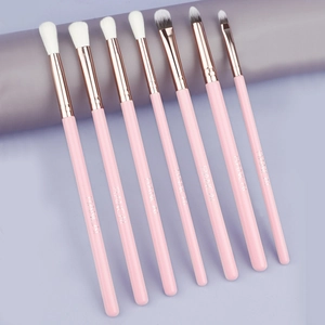 Detailed view of 7-piece pink and rose gold eye makeup brushes with soft synthetic bristles