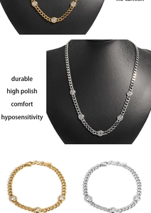 Close-up of gold and silver cuban chain necklaces and bracelets with zircon stones