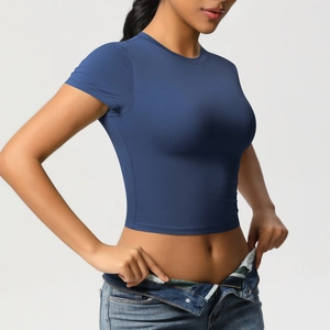 Detail of navy blue slim-fit cropped yoga t-shirt with high-quality dry-fit fabric texture