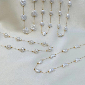 Summer gold necklace with white shell, heart, and crescent moon pearl pendants