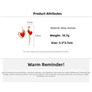 Asymmetric heart earrings with red acetate and gold alloy detail, 5.3x2.7cm size