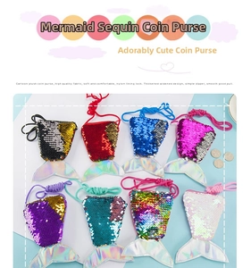 Close-up of colorful sequin mermaid tail purses with assorted zipper and strap details