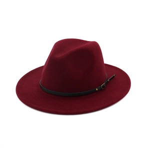 Detail of wine red wool felt fedora featuring a black leather belt and gold buckle