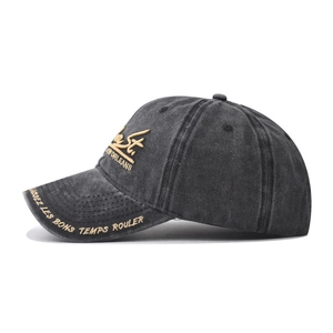 Detail of dark grey washed cotton baseball cap with New Orleans embroidery and side lettering