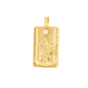 Detailed view of golden tarot card pendant with Justice figure and cubic zirconia inlay