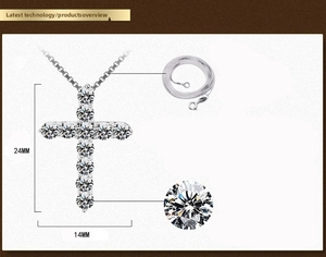 Detail view of a silver cross pendant with cubic zirconia, size 24mm by 14mm