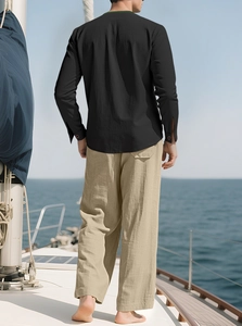 Men's casual linen shirt and pants set showing breathable fabric texture on a boat