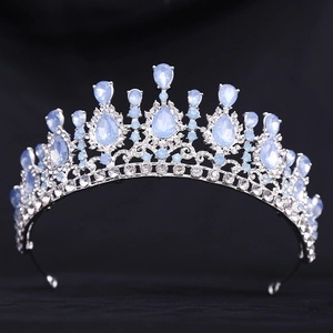 Close-up of bridal crown with silver base, blue teardrop stones and crystal diamonds