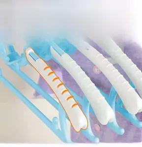 Detail of adjustable baby clothes hanger with wide non-slip shoulder pads and blue finish