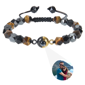Detail of photo projection bracelet featuring hematite beads and custom image display