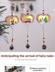 Close-up of wooden LED Christmas heart pendants with Santa, snowman and pine cone details