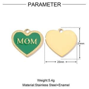 Detail of green enamel heart pendant with golden MOM lettering and stainless steel back