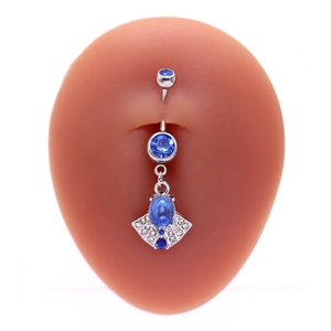 Silver belly ring with blue heart pendant and crystals on a silicone body model