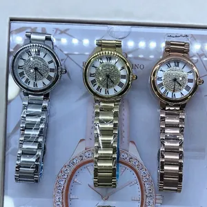 Three elegant women's watches in gold, silver, and rose gold with crystal-encrusted dials