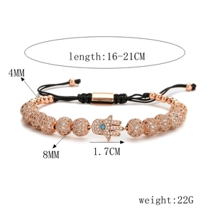 Macro view of adjustable Hamsa hand bracelet with zircon details and size specifications