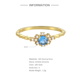 Elegant S925 sterling silver ring featuring a snowflake blue zircon and gold plating