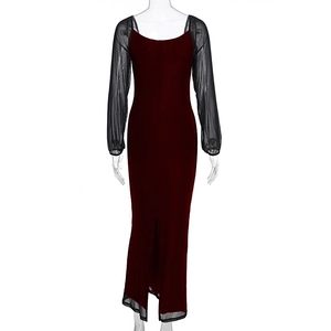Detail of the high-slit hem and sheer mesh long sleeves on a burgundy bodycon dress