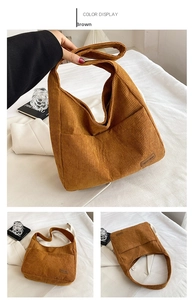 Detail of brown corduroy tote bag showing spacious interior and magnetic closure