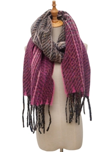 Detail of pink and brown woven scarf featuring herringbone patterns and soft fringe