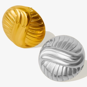 Detailed macro view of 304 stainless steel gold and silver round ribbed stud earrings