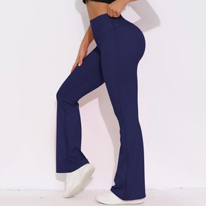 Detail view of high waist flared yoga pants in navy blue with sculpting stitch lines