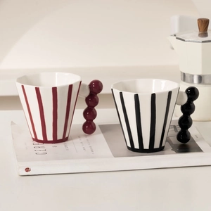 Ceramic striped mug set with creative bubble handles and artistic hand-painted finish