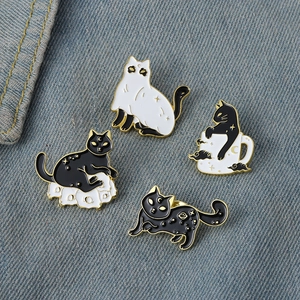 Set of 4 creative cat enamel pins with black and white feline and moon motifs