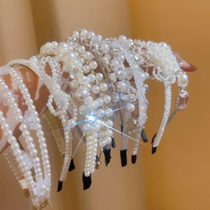 Detailed view of assorted French retro pearl headbands with sparkling rhinestones decoration