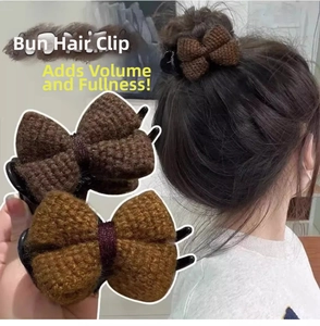 Detail of the knit bow hair claw clip showing thick texture and dark brown fabric