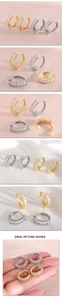 Detailed views of gold and silver hoop earrings featuring square-cut cubic zirconia stones