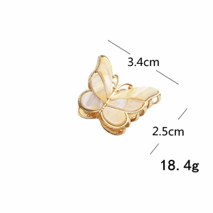 Vintage golden butterfly hair claw with enamel wings in a 3.4cm x 2.5cm size