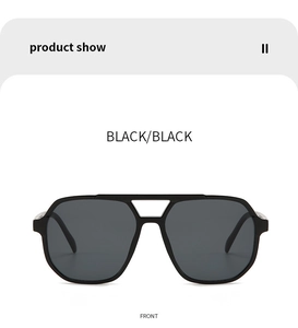 Front view of black double-bridge aviator sunglasses with wide frames and dark lenses
