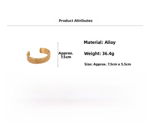 Detail of vintage embossed gold oval bangle showing weight 36.4g and 7.5cm size