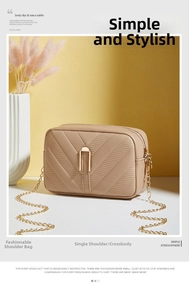 Detail of beige crossbody bag featuring V-quilted pattern and golden chain strap