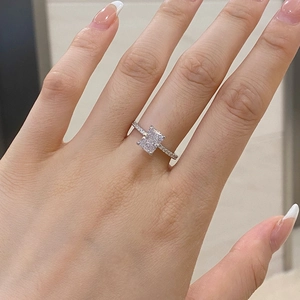 Close-up of s925 silver ring with radiant cut central stone on model hand