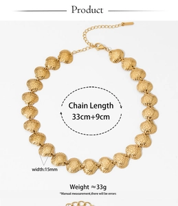 Detailed shot of golden shell necklace showing lobster clasp and adjustable chain length