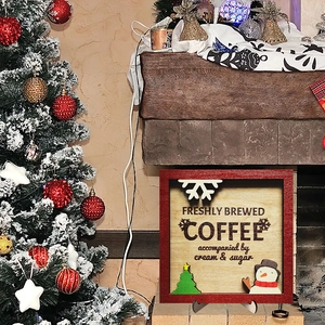 Christmas wooden coffee sign with snowman and tree on a cozy fireplace mantel