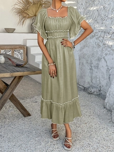 Detail view of olive green maxi dress with square neck and ruffled sleeve white piping