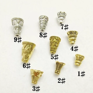 Various antique silver and gold alloy bead caps with embossed patterns for jewelry making