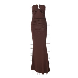 Detail of a brown bodycon dress with elegant ruched fabric and a slim fit silhouette