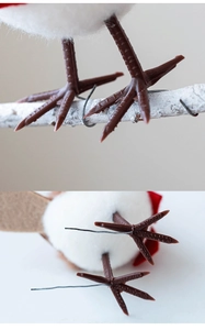 Macro shot of faux bird with plush white feathers and flexible wire on brown feet